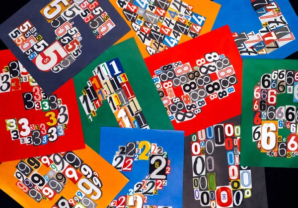 Ten numbers made from numbers cutting from magazines on black ba — Stock Photo, Image