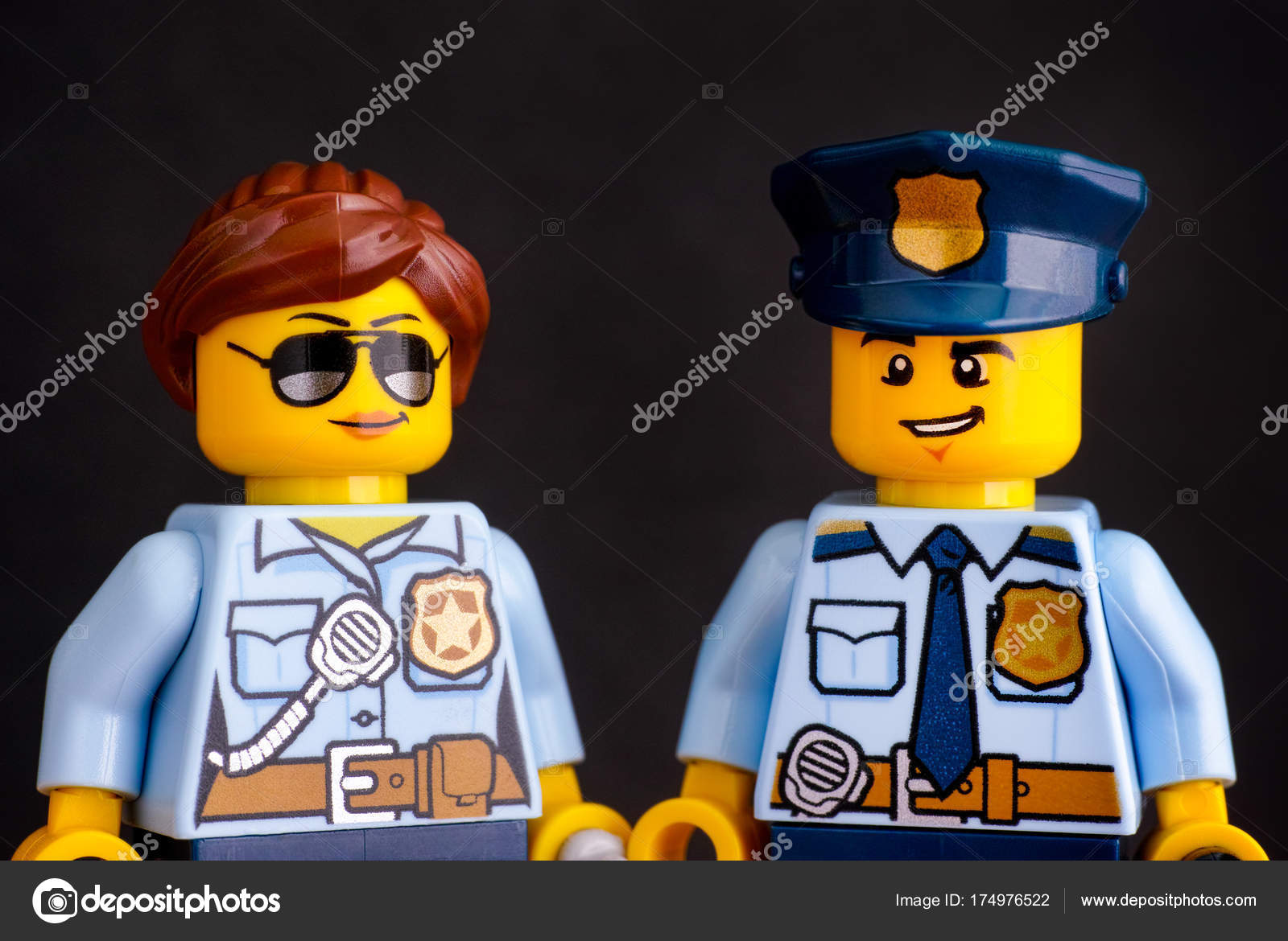 Portrait of Lego policeman and policewoman minifigures on black