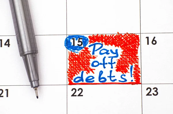 Reminder Pay off Debts in calendar with pen. — Stock Photo, Image