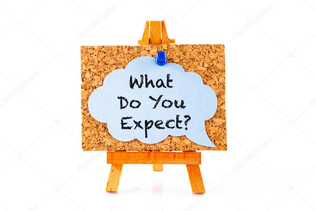 Wooden easel with corkboard and blue speech bubble