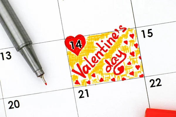 Reminder Valentines Day in calendar with red pen.