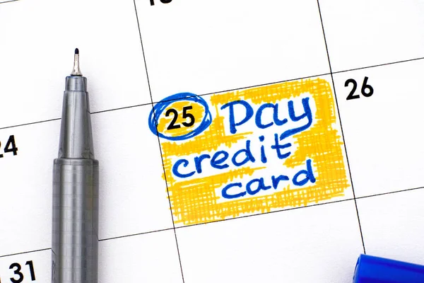 Reminder Pay Credit Card in calendar with blue pen. — Stock Photo, Image