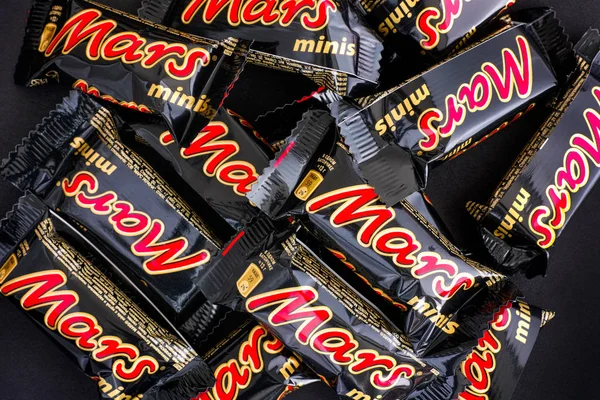 Mars minis candy bars on black background — Stock Photo, Image