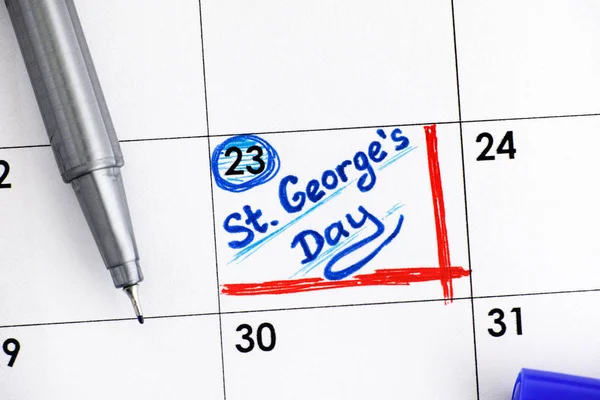 Напоминаем Свято-Георгиевский День в календаре синей ручкой — стоковое фото
