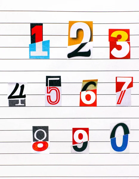 Ten numbers made from half numbers cutting from magazines on lin — Stock Photo, Image