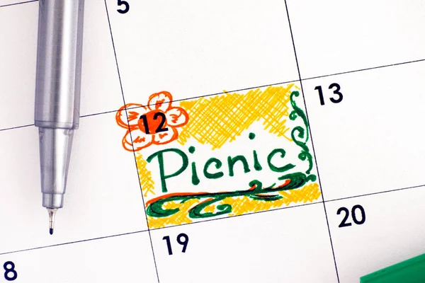 Reminder Picnic in calendar with green pen.