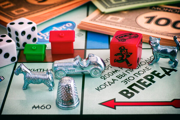 Monopoly Board Game. Field Go of gameboard with tokens, dices, m