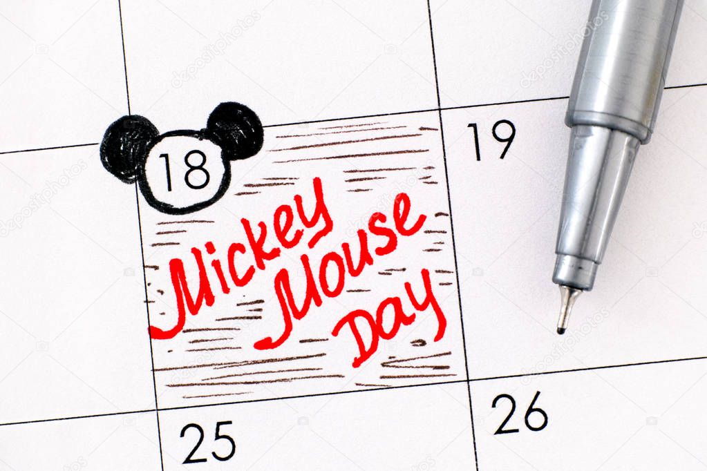 Reminder Mickey Mouse Day in calendar with pen. November 18. 