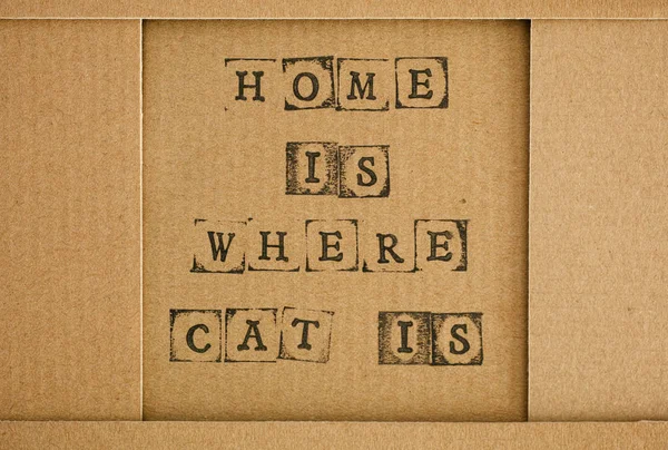 Картон со словами Home Is Where Cat Is — стоковое фото