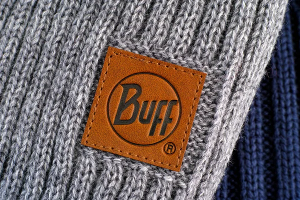 Close-up of clothes label Buff on gray knitted hats. — 스톡 사진