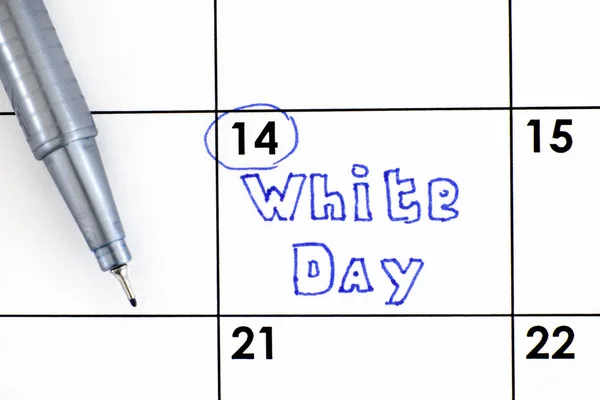Reminder White Day in calendar with pen.  March 14.