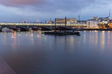 LONDON, ENGLAND - JUNE 17 2016: Night Photo of Thames River and Blackfriars Bridge, London clipart