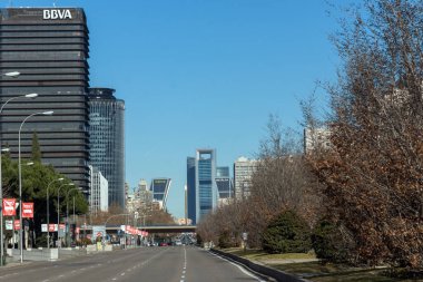 MADRID, SPAIN - JANUARY 21, 2018:  Business buildings at Paseo de la Castellana street in City of Madrid, Spain clipart