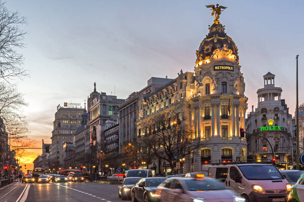 MADRID, SPAIN - JANUARY 23, 2018: Sunset view of Gran Via and Metropolis Building in City of Madrid, Spain