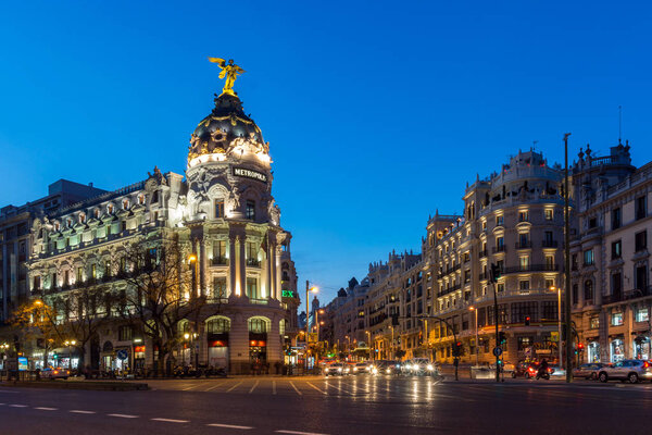 MADRID, SPAIN - JANUARY 23, 2018: Sunset view of Gran Via and Metropolis Building in City of Madrid, Spain