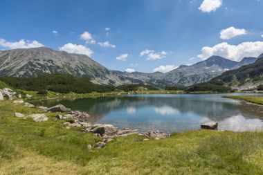Amazing Landscape with Muratovo Lake, Banderishki Chukar and Todorka Peaks, Pirin Mountain, Bulgaria clipart