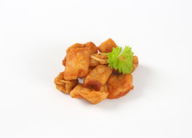 Fried pieces of pork rind and fat clipart