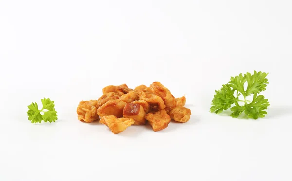 Fried pieces of pork rind and fat — Stock Photo, Image