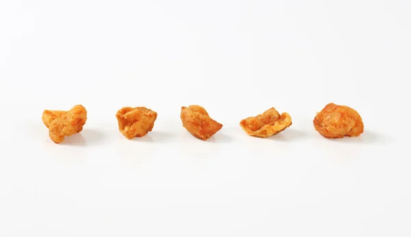 Fried pieces of pork rind and fat — Stock Photo, Image