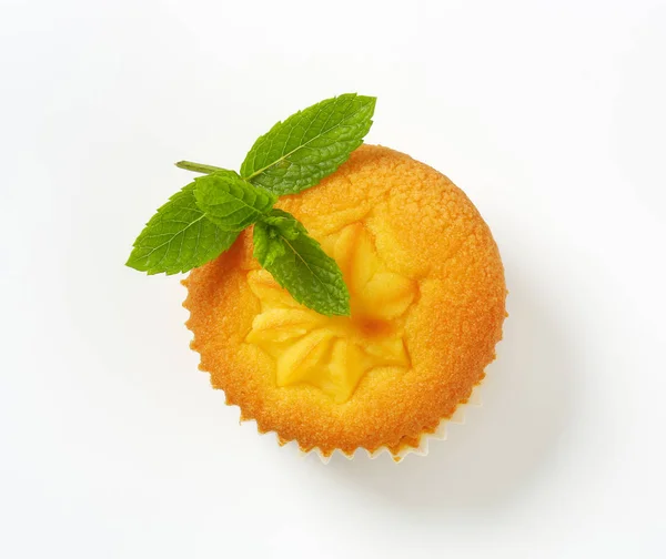 Pudding filled lemon cupcake — Stock Photo, Image