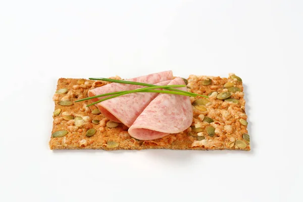 Pumpkin seed cracker with deli meat — Stock Photo, Image