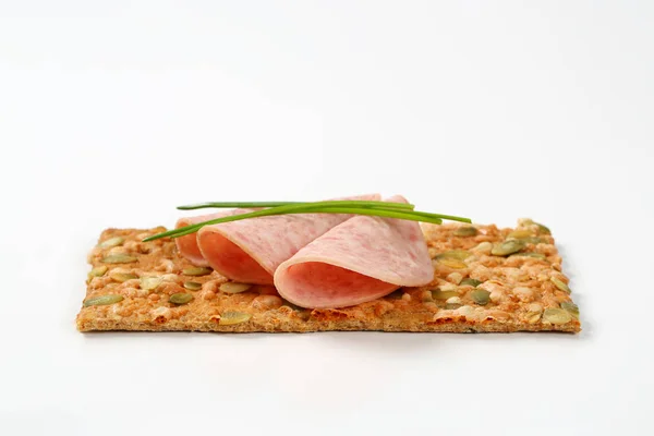 Pumpkin seed cracker with deli meat — Stock Photo, Image