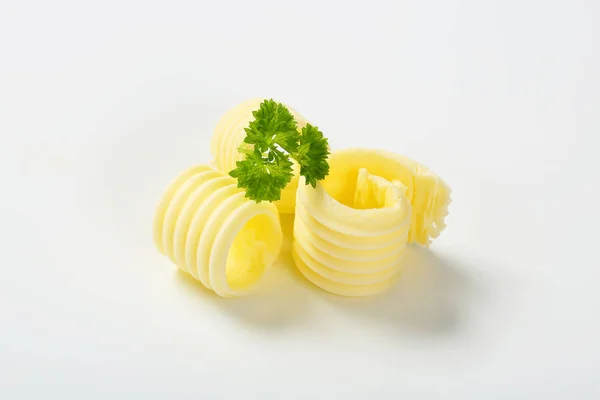 Butter curls with parsley — Stock Photo, Image