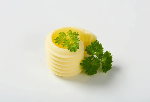 Curl másla s petrželkou — Stock fotografie