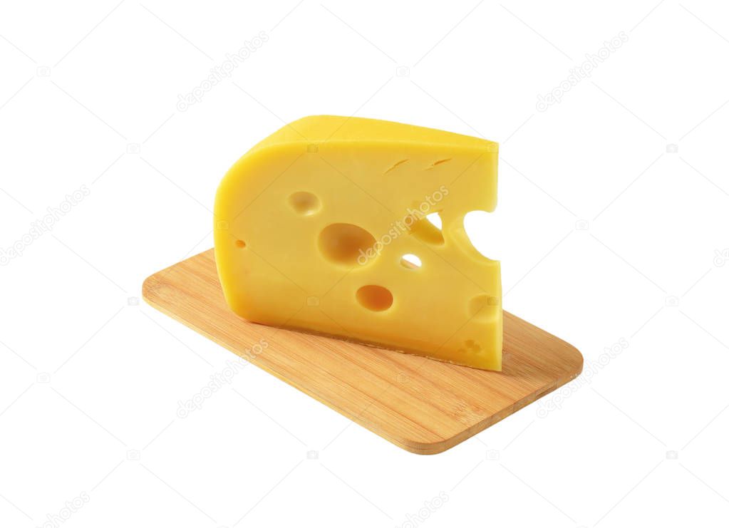 wedge of yellow cheese with eyes