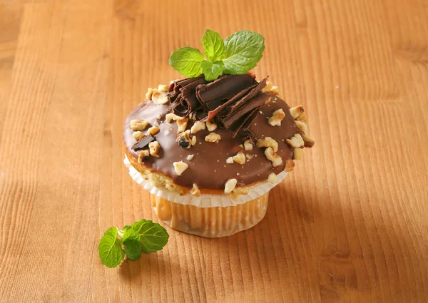 Hazelnut muffin with chocolate topping — Stock Photo, Image