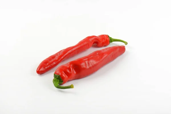 Dvě červené papriky — Stock fotografie