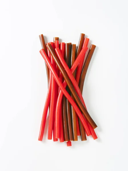 Soft strawberry and cola candy sticks — Stock Photo, Image