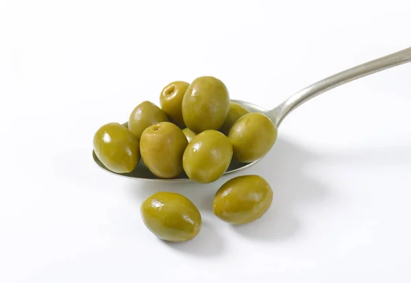 Spoon of green olives — Stock Photo, Image