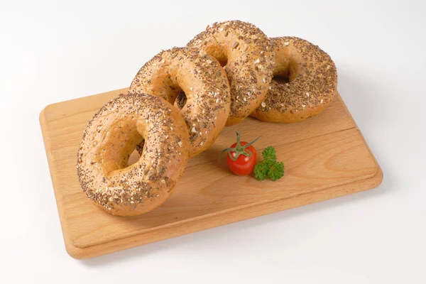 Fresh bagels with seeds — Stock Photo, Image