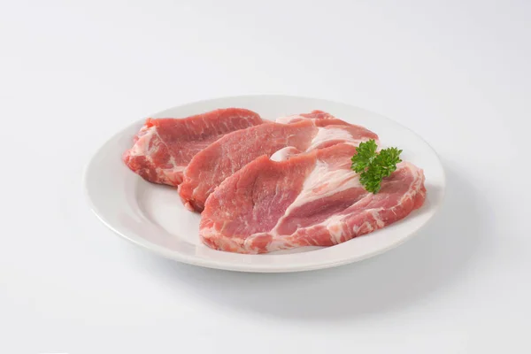 Raw pork neck steaks — Stock Photo, Image