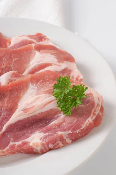 Raw pork neck steaks — Stock Photo, Image