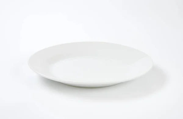 Round porcelain plate — Stock Photo, Image