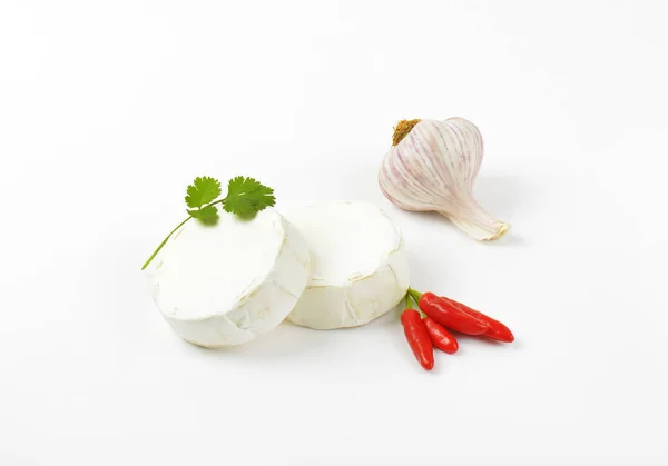 Soft white cheese, red chili peppers and garlic — Stock Photo, Image