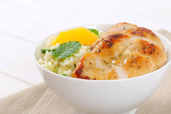 Roasted chicken breast with rice and oranges — Stock Photo, Image