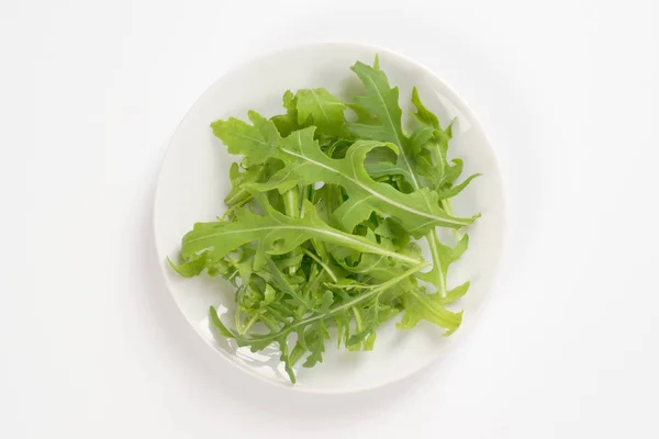 Plate of fresh arugula — Stock Photo, Image