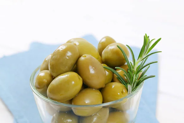 Green olives with rosemary — Stock Photo, Image