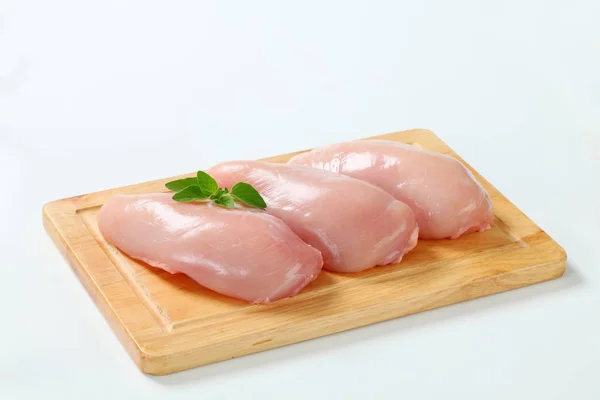 Raw skinless chicken breast fillets — Stock Photo, Image