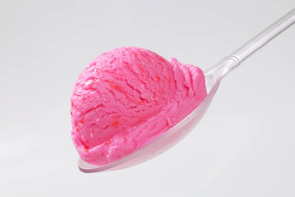 Scoop of pink ice cream on spoon — Stock Photo, Image