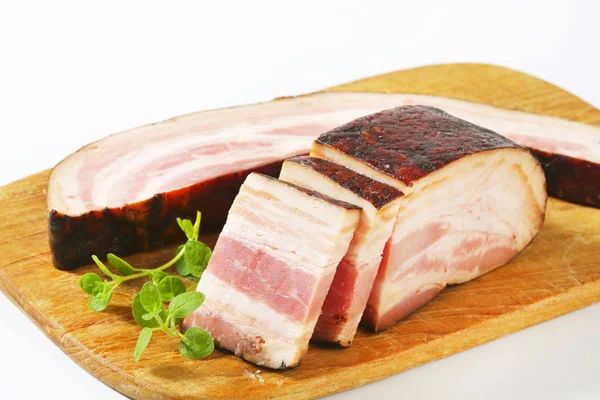 Smoked bacon slab and slices — Stock Photo, Image