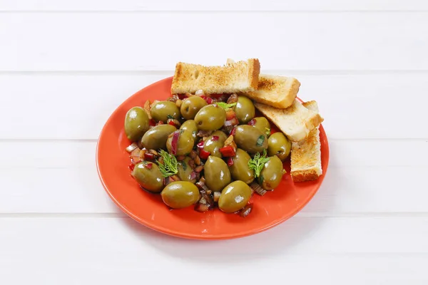 Marinated green olives with toast — Stock Photo, Image