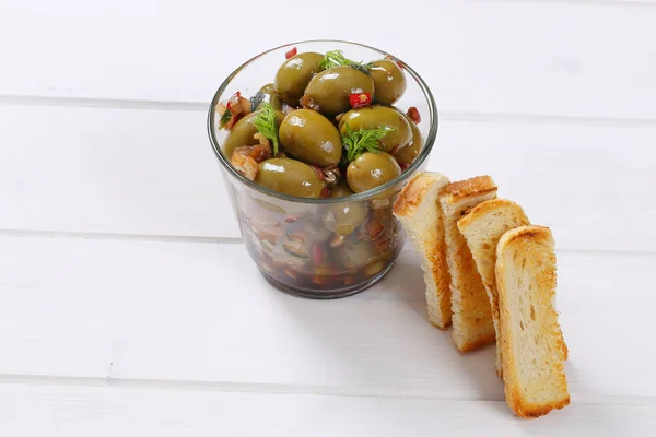 Marinated green olives with toast — Stock Photo, Image