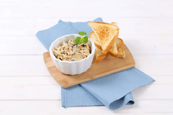 Grated cheese and olive spread with toast — Stock Photo, Image