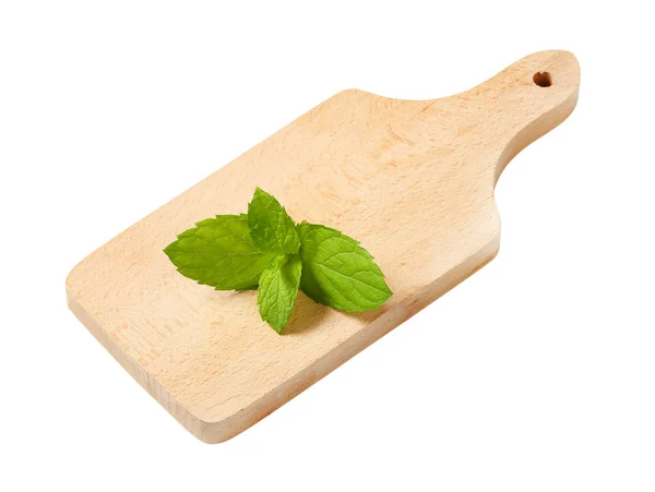 Mint leaves on cutting board — Stock Photo, Image