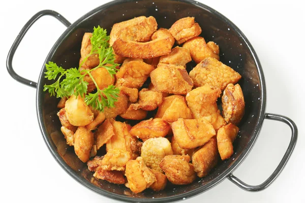 Pork greaves in a skillet — Stock Photo, Image