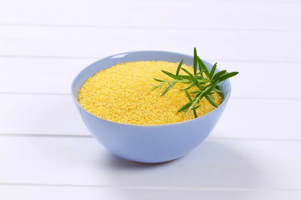 Bowl of raw millet grain — Stock Photo, Image